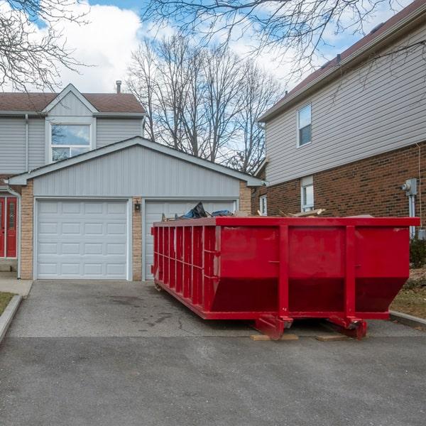 dump truck loading construction dumpster